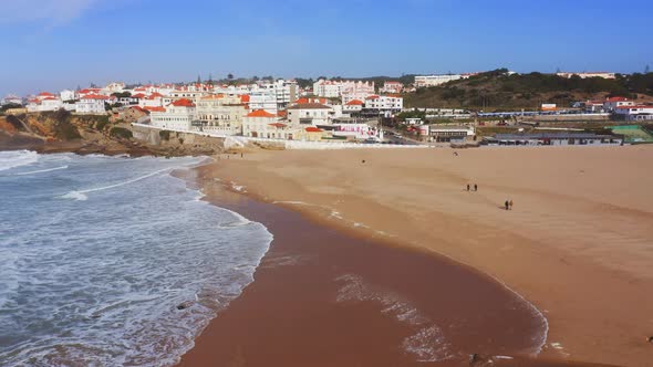 Aerial Drone View of Sandy Beach at Lisbon, Portugal at Praia das Macas, a Beautiful Coastal Town on