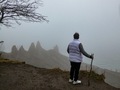 Woman looking into the foggy bluff shoreline  - PhotoDune Item for Sale