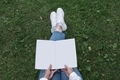 woman sitting in the park on the lawn and reading a book - PhotoDune Item for Sale