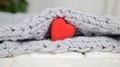 red decorative heart on a knitted gray background - PhotoDune Item for Sale