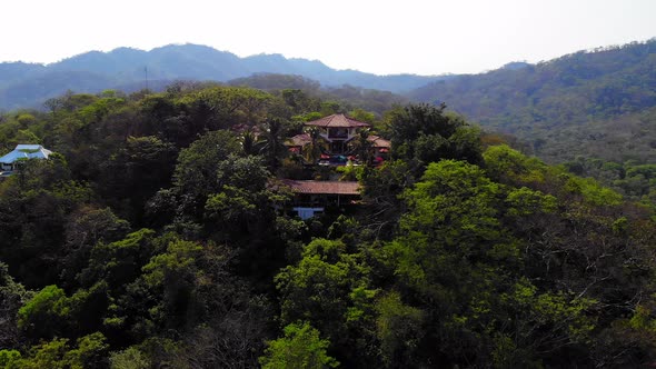 Lowering drone shot of a resort in Tamarindo Costa Rica, Los Altos de Eros.
