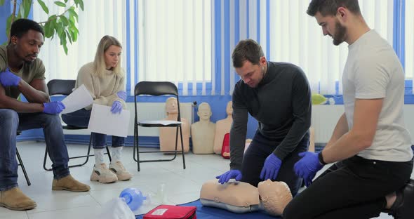 Male Instructor Teaching First Aid Cpr Technique to His Students