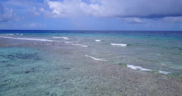 Tropical aerial abstract shot of a white sand paradise beach and blue water background in colourful 