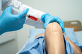 Asian doctor inject Hyaluronic acid platelet rich plasma into the knee of senior woman to walk   - PhotoDune Item for Sale