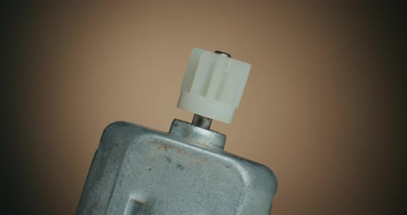 Close up of a DC Motor Gear Head and Macro Shot of Electronic Components on Turn Table