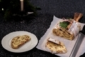 Traditional Christmas stollen with dried fruits, raisins and marzipan decorated with sugar powder - PhotoDune Item for Sale