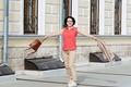 woman in casual clothes walks down the street and enjoys shopping - PhotoDune Item for Sale