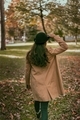 Portrait of rear young woman standing by tree during autumn - PhotoDune Item for Sale