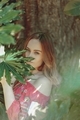 Portrait of young girl against tree - PhotoDune Item for Sale