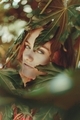 Portrait of young woman with green leaves - PhotoDune Item for Sale