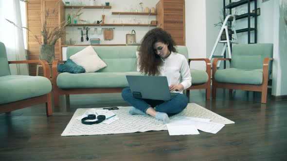 Female Worker Types on Laptop During Quarantine, Covid-19 Lockdown. Remote Work Concept.