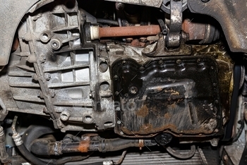 om below, visible engine components.
bottom view, engine underside, tube, car engine, service, gear, valve, compressor, car radiator, tensioning belt, inside, maintenance, automotive, diesel, closeup, workshop, hose, old, part, muff, repair, detail, bearing, belt, oil, dirty, machine, engineering, gearbox, engine, vehicle, auto, motor, industrial, metal, garage, spare, car, automobile, precision, steel, crankshaft, metallic, piston, energy, generator