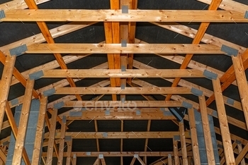  house under construction, view from the inside, visible roof elements and truss plates.


	truss plates, membrane, foil, roof covering, roof, truss, upper truss, roof rafter, batten, counter battens, wall plate, forceps, truss beam, strut, wreath, wooden support, prickly plate, build, beam, attic, beams, skeleton, construction, bearing walls, concrete poles, concrete wreath, wood, structure, house, home, wooden, building, lumber, rafters, timber, carpentry,