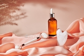 and essential oil on a silk cloth. Home skin care anti-aging concept
