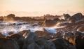 Dreamy ocean waves crashing on a rocky beach at sunset in Jacobsbaai, South Africa. - PhotoDune Item for Sale