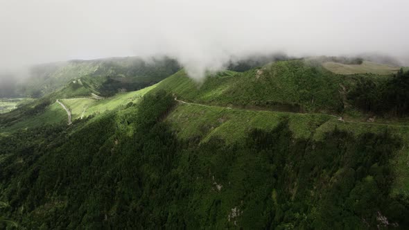 Aerial View of Green Hills in Clouds of Sao Miguel