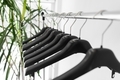 Plastic empty clothes hangers on rack - PhotoDune Item for Sale