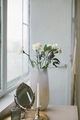Fresh flowers in beautiful glass vase on dresser in bedroom. - PhotoDune Item for Sale