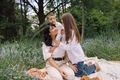 Beautiful mother with children on picnic in the park. Family time. Summertime  - PhotoDune Item for Sale