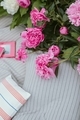 Beautiful bush of peonies, bed linen, pillow and books. - PhotoDune Item for Sale
