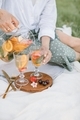 Close up of woman drinking cocktail on picnic in nature.  - PhotoDune Item for Sale