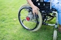 Asian senior woman patient sitting and control electric wheelchair in park at hospital. - PhotoDune Item for Sale