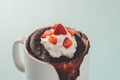 Close up shoot of Red Velvet mug cake with strawberry slices - PhotoDune Item for Sale