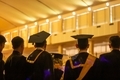 A back shoot of students walking into the room to celebrate their graduation. - PhotoDune Item for Sale