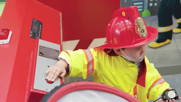 2-year-old Girl In Firefighter Costume In Gyeonggi Children's Museum, South Korea - medium shot