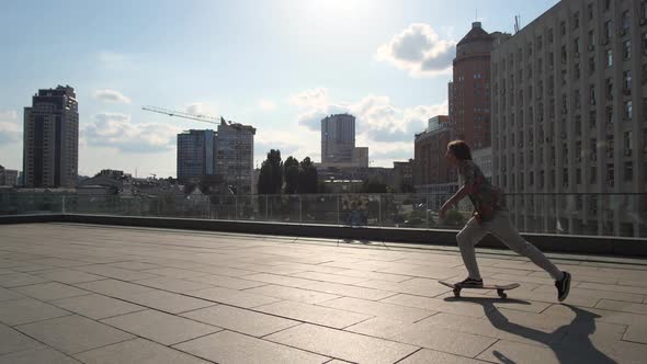 Skillful Male Skater Riding Skateboard in City