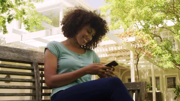 Mixed race woman using his phone