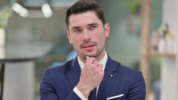 Pensive Young Businessman Thinking About Something 