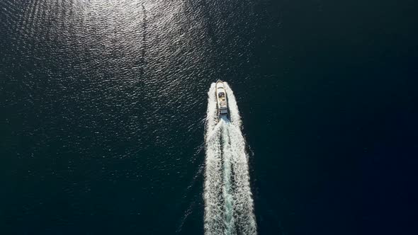 Aerial view of a motorboat along the coast, Elba Island, Italy.