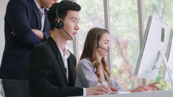 Business People Wearing Headset Working in Office