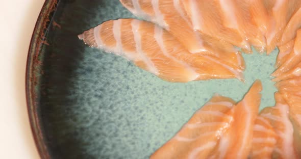 Plate Of Fresh Salmon Fillet Served In A Japanese Restaurant - Salmon Sashimi Dish. - high angle - p