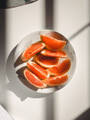 Grapefruits on a white table.  - PhotoDune Item for Sale