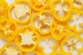 Yellow sliced bell pepper cross section full frame background - PhotoDune Item for Sale