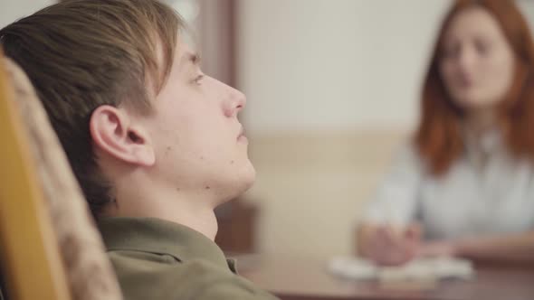 Portrait Young Guy at a Session with a Psychotherapist