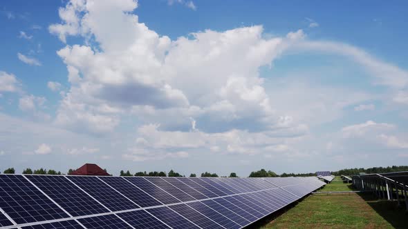 Solar panels stand in a row in the fields power ecology. Innovation nature environment green energy