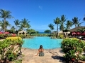 Beautiful woman with her coffee sitting by pool & palm trees in Maui Hawaii. Island life rules. - PhotoDune Item for Sale