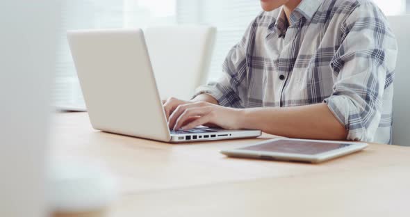 Businesswoman working on laptop