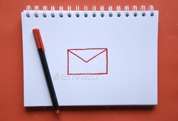 ed email or mail sign and pen on red background. The logo of gmail. Concept of social media, technology and communication.