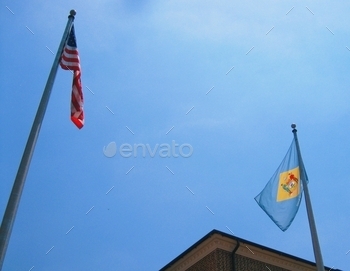 e First State to declare independence from the British. The flags of United States and Delaware on a beautiful blue sky. Flags, sky, looking up, Delaware, United States,MyLove4Art photos