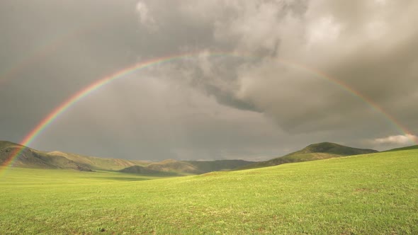 Colorful Rainbow in Vast Treeless Meadow