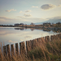Calm scenery with fences around a great pond reflecting the sky - PhotoDune Item for Sale