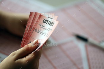 the lottery ticket with complete row of numbers on the lottery blank sheets background. Gambling concept