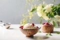 Homemade caramel vanilla ice cream with frozen raspberries in ceramic bowl standing on white marble - PhotoDune Item for Sale