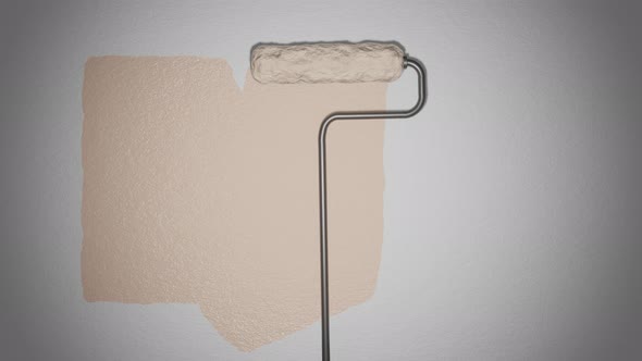 Roller paints the wall with beige paint.