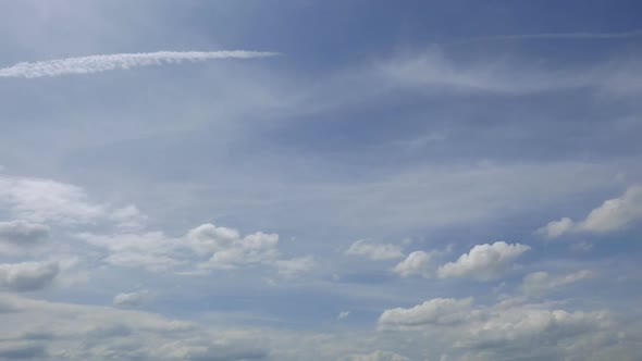 Time lapse of white cloud moving pass around sky background