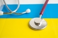 Stethoscope on Ukraine flag. - PhotoDune Item for Sale